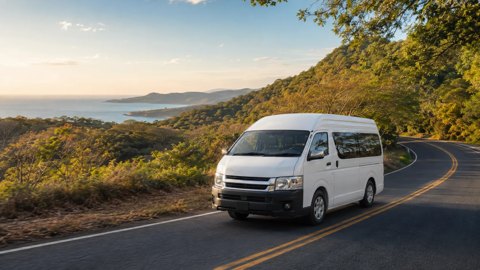Private Costa Rica shuttle van traveling along a scenic coastal road in Guanacaste